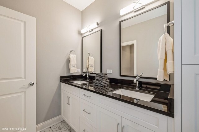 1062 Livingston Ave, Highland Park, IL 60035 - full bathroom featuring double vanity and baseboards