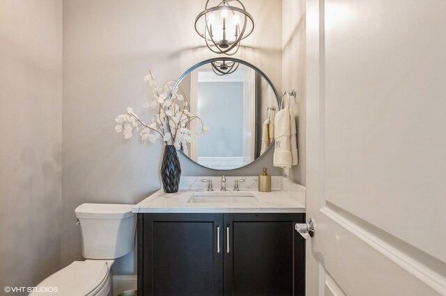 1062 Livingston Ave, Highland Park, IL 60035 - half bathroom featuring vanity and a chandelier