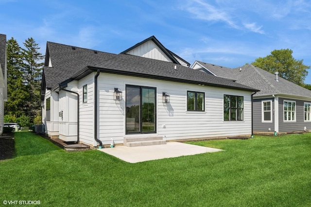 1062 Livingston Ave, Highland Park, IL 60035 - rear view of house with a lawn, a patio, entry steps, and roof with shingles