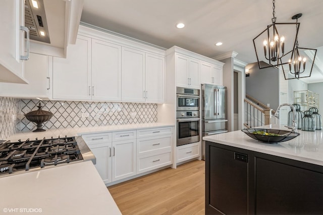 1062 Livingston Ave, Highland Park, IL 60035 - kitchen featuring light countertops, white cabinetry, pendant lighting, a chandelier, and recessed lighting