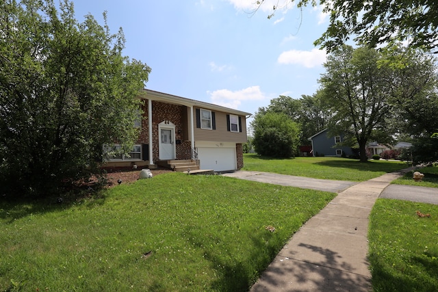 bi-level home with a front yard and a garage