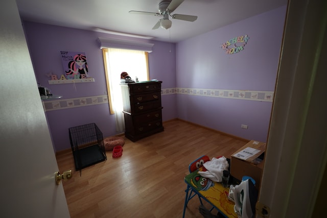 bedroom featuring ceiling fan and light wood-type flooring