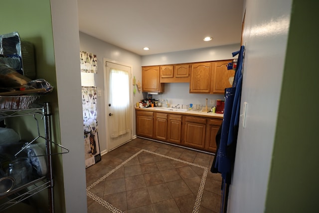 kitchen with dark tile floors and sink