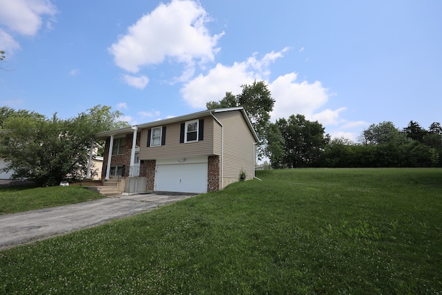 split foyer home featuring a front yard and a garage