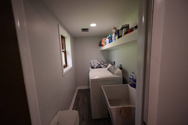 laundry room featuring hookup for a washing machine, washing machine and dryer, dark wood-type flooring, and sink