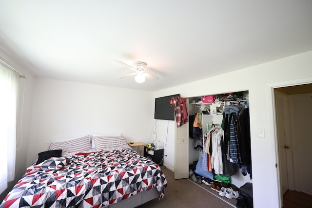 carpeted bedroom featuring ceiling fan and a closet