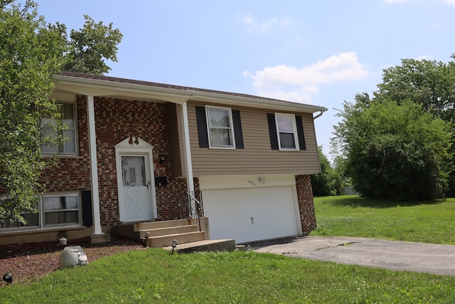 bi-level home featuring a front yard and a garage