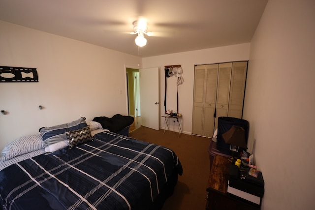 carpeted bedroom featuring a closet and ceiling fan