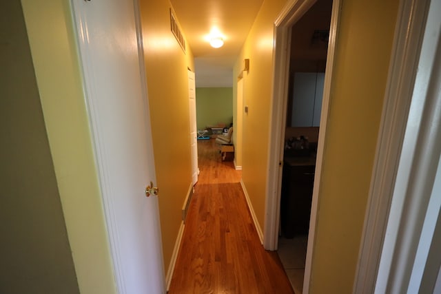 corridor featuring light wood-type flooring