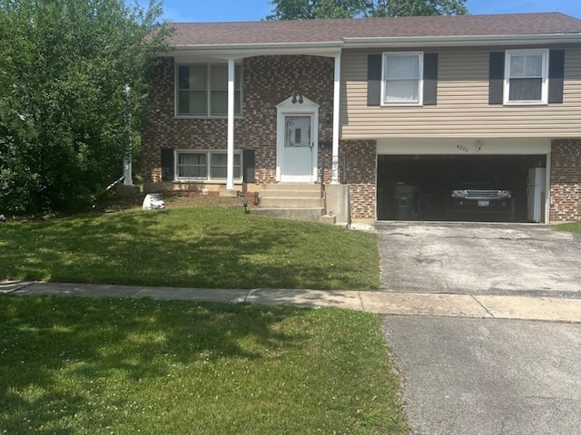 split foyer home featuring a front yard and a garage