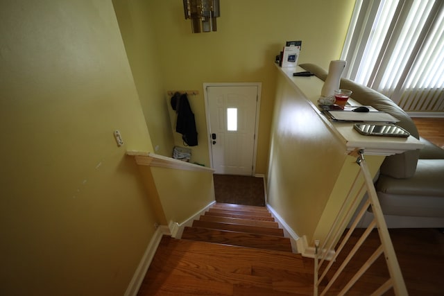 stairway featuring dark wood-type flooring