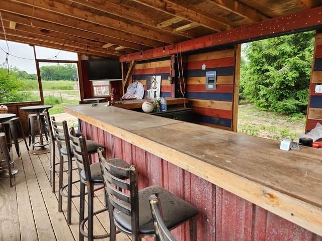 bar featuring light hardwood / wood-style floors