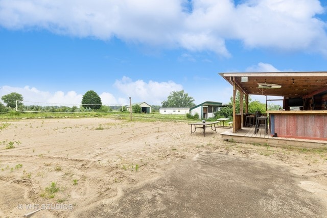 view of yard with a wooden deck