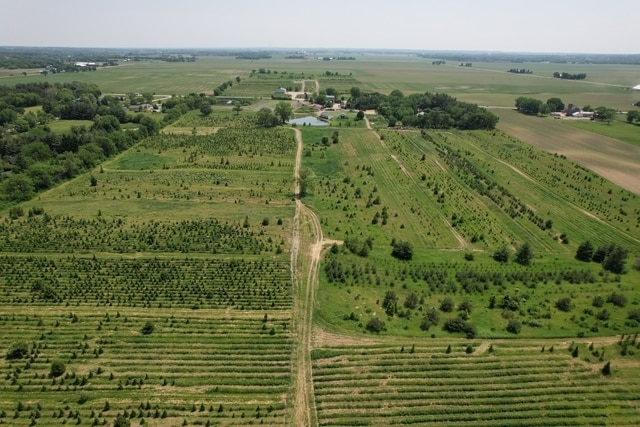 birds eye view of property with a rural view