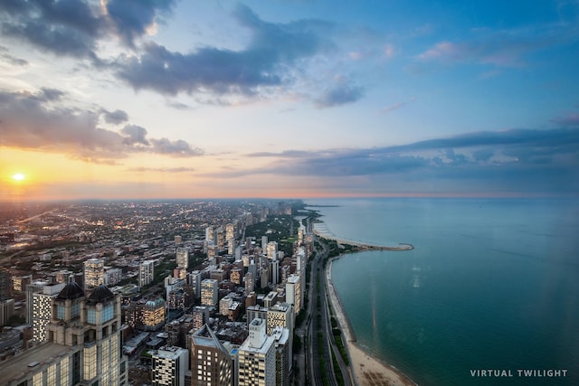 aerial view at dusk with a water view