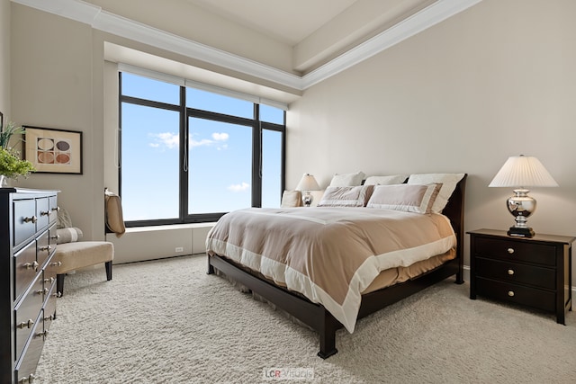 bedroom featuring light carpet and crown molding