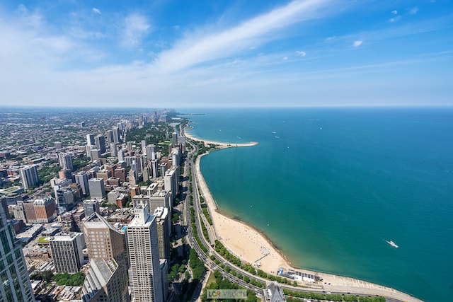 birds eye view of property with a water view