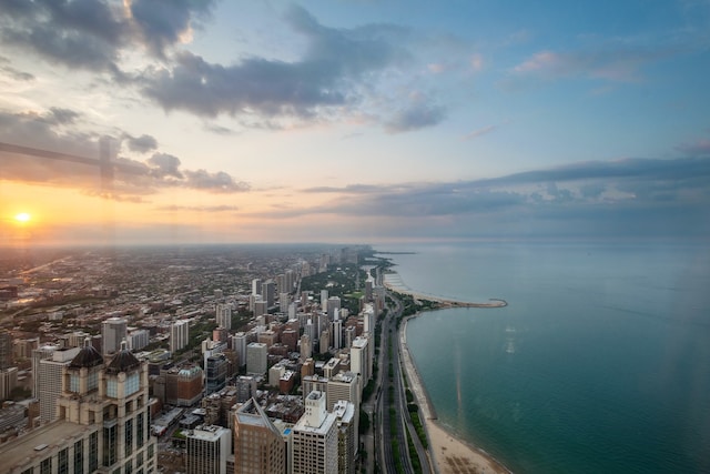 aerial view at dusk with a water view