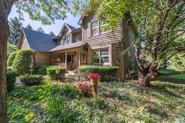 view of property featuring covered porch