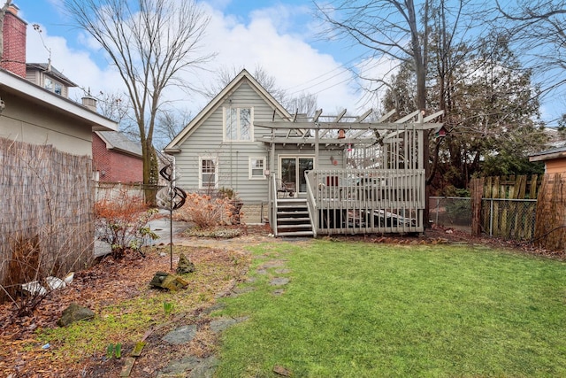 back of house with a pergola, a yard, and a wooden deck