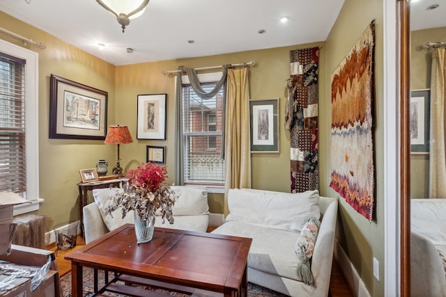 living area with hardwood / wood-style floors