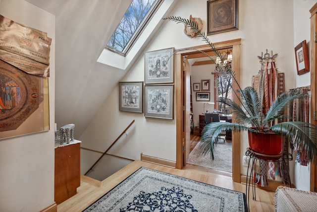 entryway featuring light hardwood / wood-style flooring and vaulted ceiling