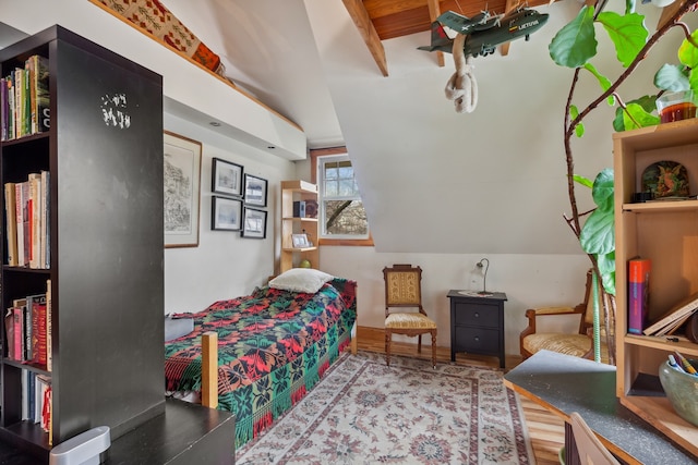 bedroom featuring light hardwood / wood-style flooring and vaulted ceiling