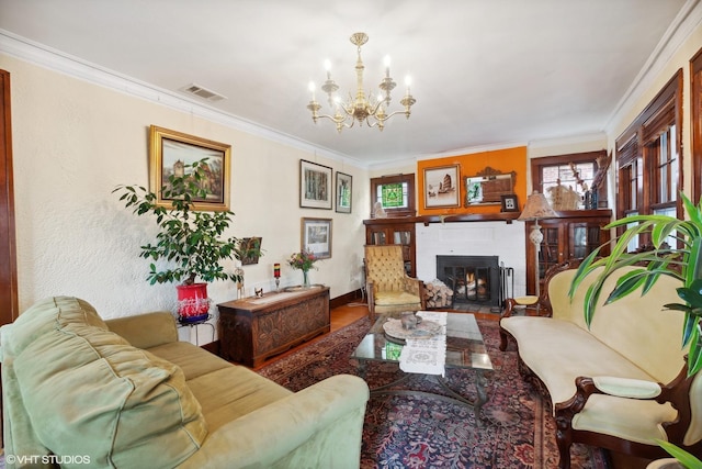 living room featuring hardwood / wood-style floors, a notable chandelier, and ornamental molding