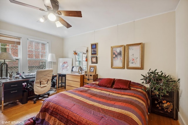 bedroom with ceiling fan and light hardwood / wood-style flooring