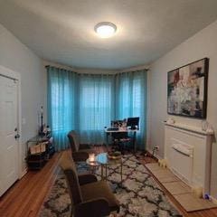 living room featuring plenty of natural light and light hardwood / wood-style flooring