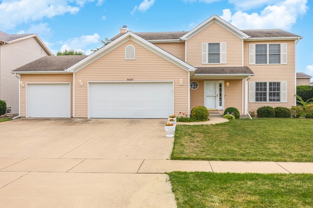 front facade with a front lawn and a garage