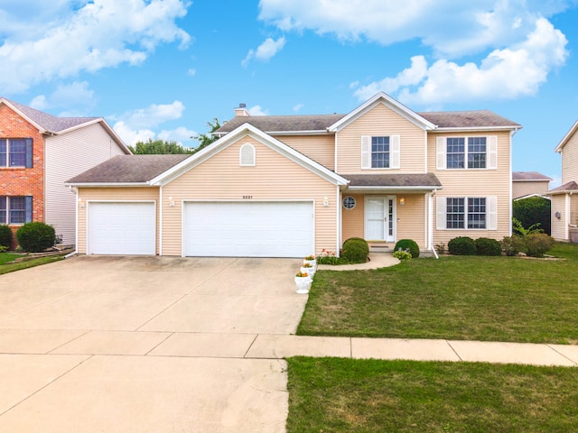 front facade featuring a front yard and a garage