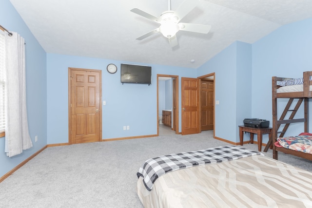 bedroom featuring ceiling fan, light carpet, and vaulted ceiling