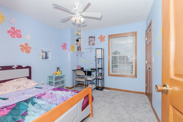 bedroom with ceiling fan and light colored carpet