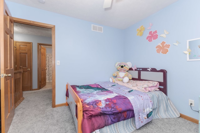 carpeted bedroom with ceiling fan