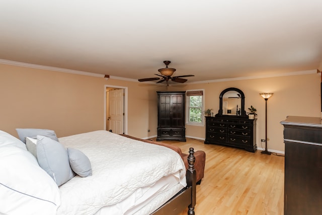 bedroom featuring ceiling fan, crown molding, and wood-type flooring