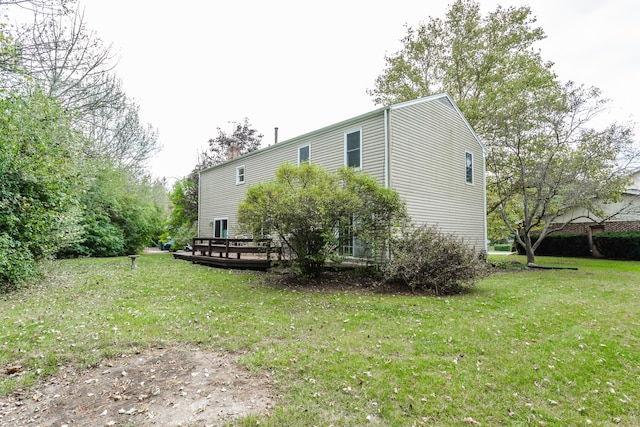 exterior space with a deck and a yard