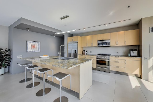 510 W Erie St Unit 1801, Chicago, IL 60654 - kitchen featuring high quality appliances, track lighting, light brown cabinetry, light stone counters, and a kitchen breakfast bar