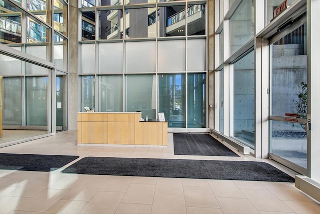 510 W Erie St Unit 1801, Chicago, IL 60654 - reception area with a towering ceiling and a wall of windows