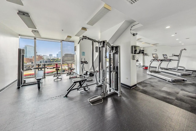 510 W Erie St Unit 1801, Chicago, IL 60654 - gym with a wall of windows and recessed lighting