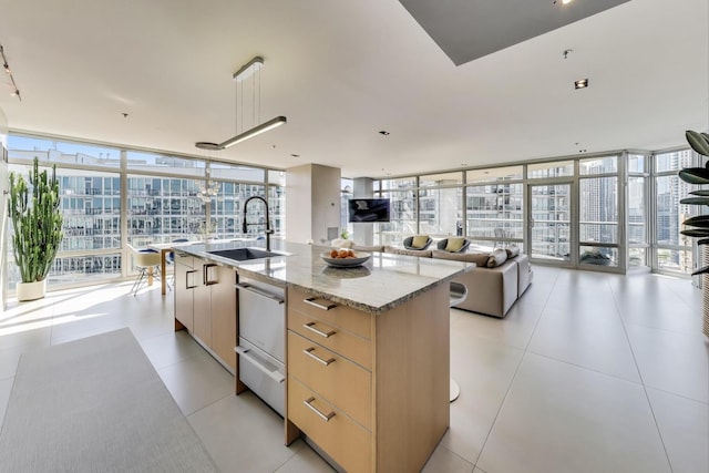 510 W Erie St Unit 1801, Chicago, IL 60654 - kitchen with modern cabinets, floor to ceiling windows, plenty of natural light, light brown cabinets, and open floor plan