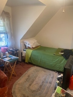 bedroom featuring lofted ceiling