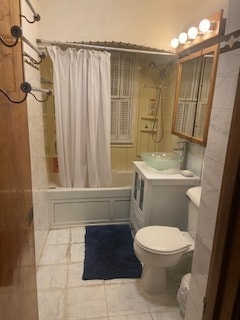 full bathroom with tile floors, toilet, shower / bath combo with shower curtain, and large vanity