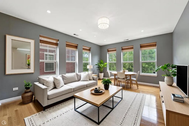 3811 S Langley Ave Unit 301, Chicago, IL 60653 - living area with light wood-type flooring, a chandelier, and recessed lighting