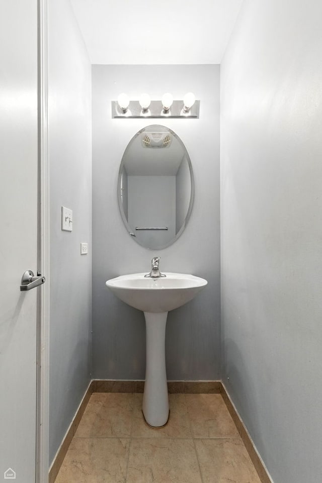 3811 S Langley Ave Unit 301, Chicago, IL 60653 - bathroom featuring baseboards and tile patterned flooring