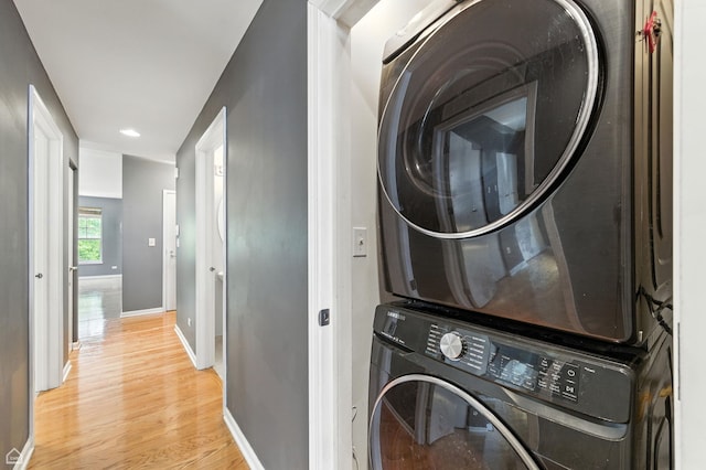 3811 S Langley Ave Unit 301, Chicago, IL 60653 - laundry area with stacked washer and clothes dryer, light wood-style flooring, and recessed lighting