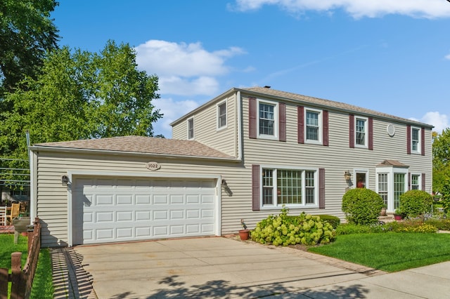 colonial home with a garage