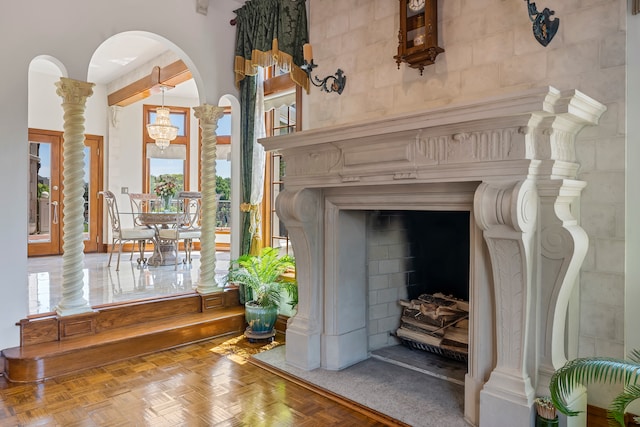 interior details featuring parquet flooring and a chandelier