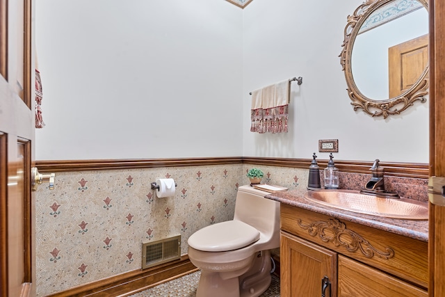 bathroom with vanity and toilet