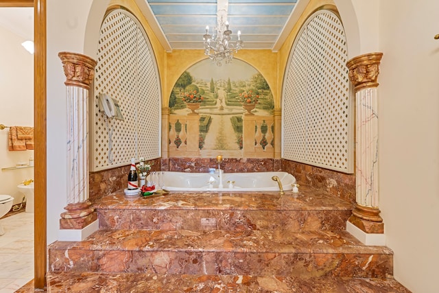 bathroom featuring toilet, crown molding, and tiled bath